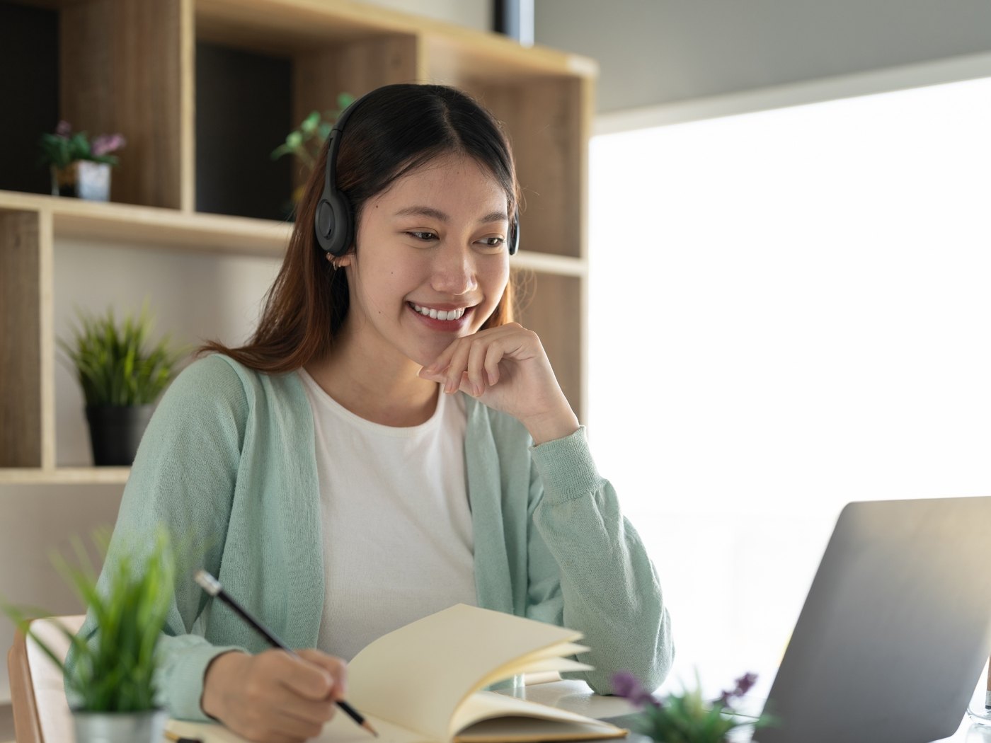 An Ask Velma virtual medical assistant on a client call from her home office